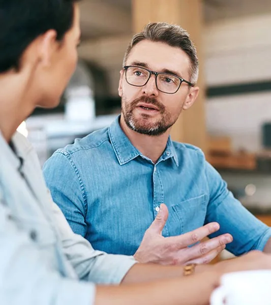 Colleagues discussing a project in the office
